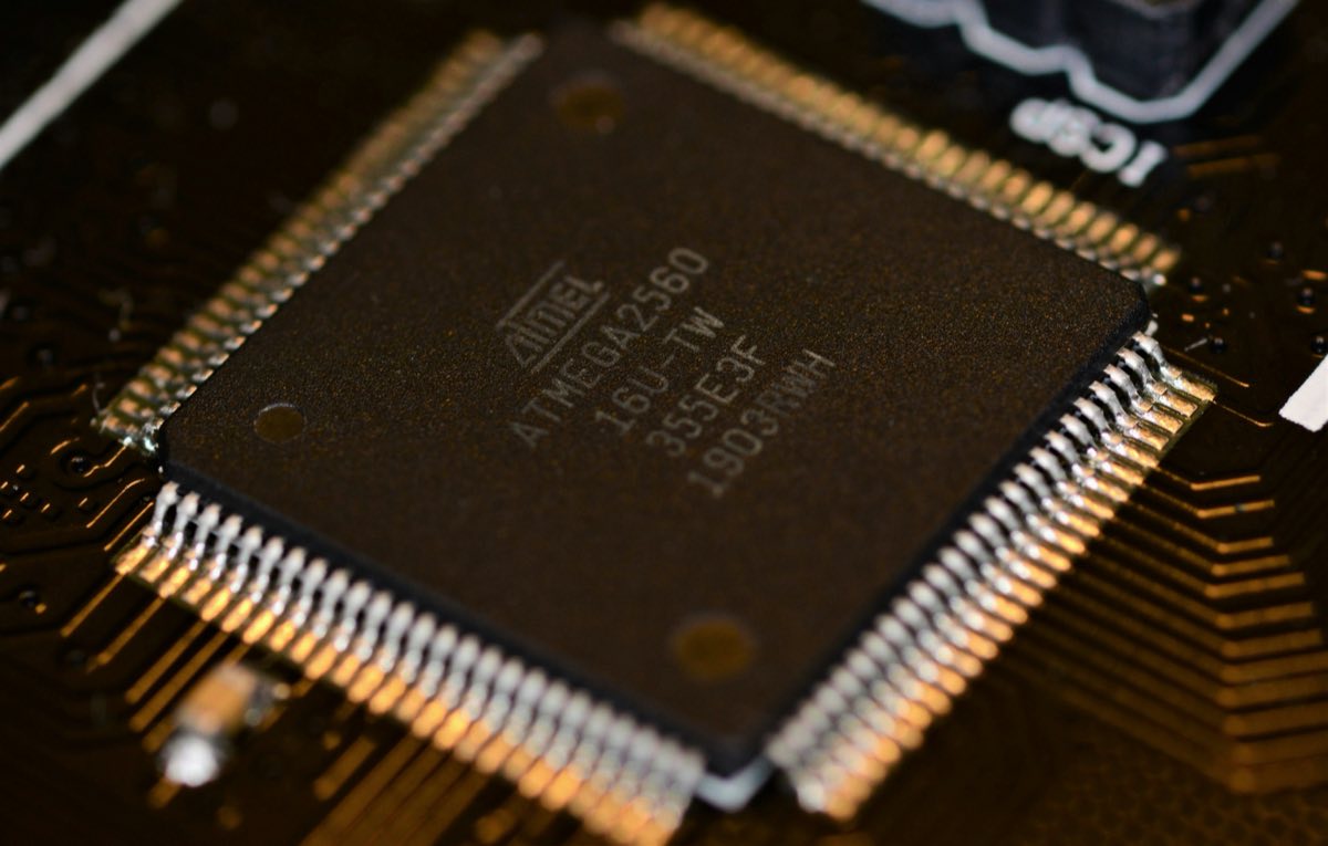 Close-up of a microcontroller soldered onto a circuit board
