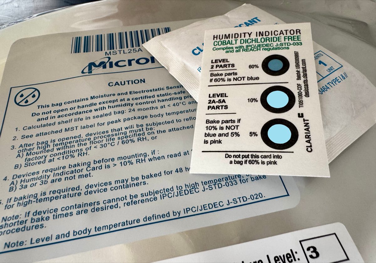 Sealed moisture barrier bag with its caution label, desiccant pack, humidity indicator card and MSL level 3 marking